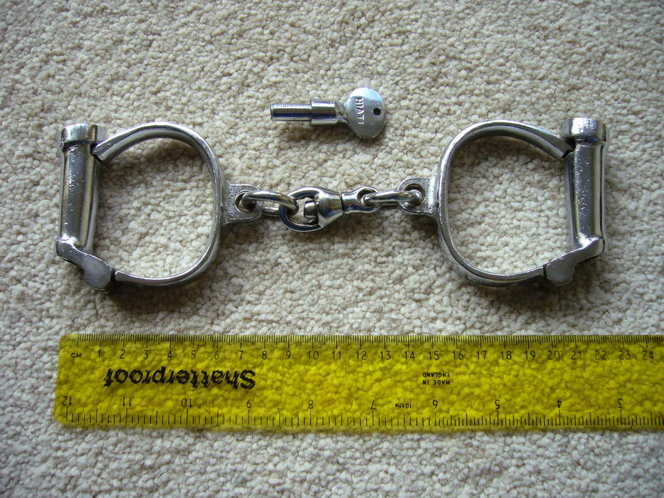 Handcuffs: Restraint devices